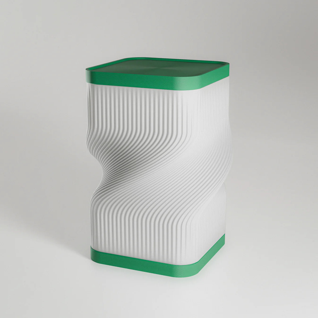 Decorative table lamp with wavy design on a wooden surface in a dimly lit room.