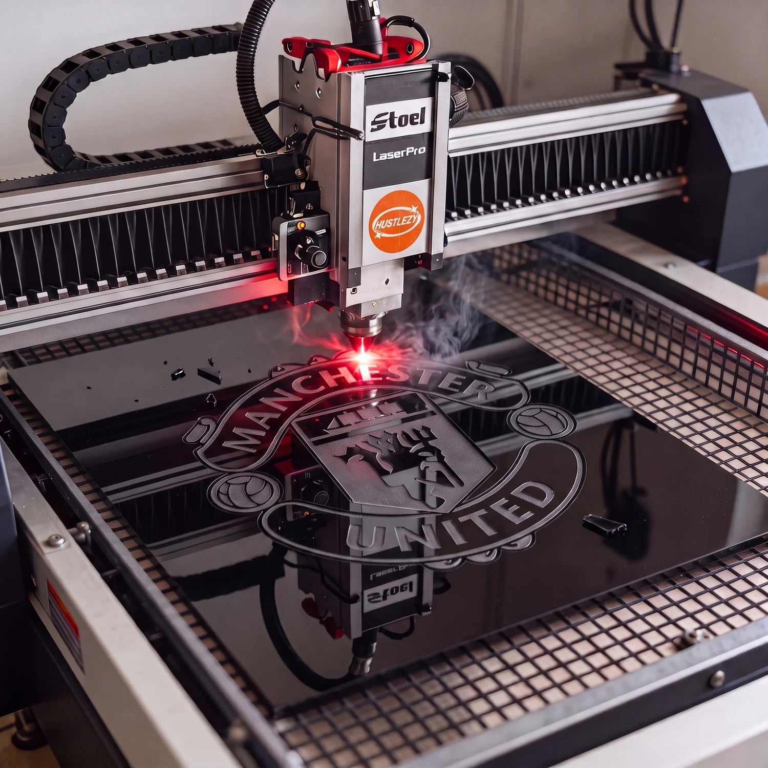 Hustlezy laser engraving a club crest into black MDF